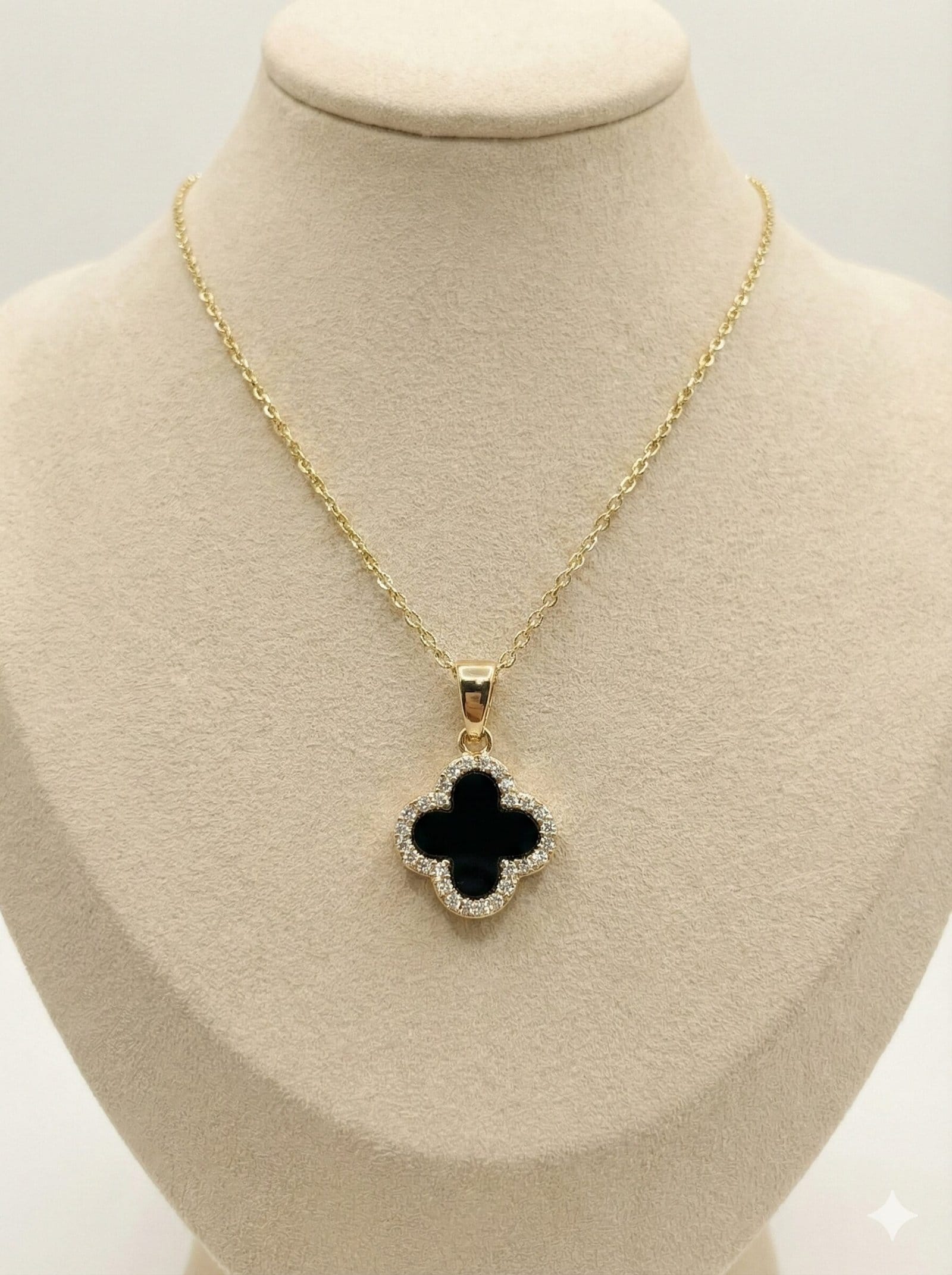 Gold-Tone Quatrefoil Pendant Necklace with Black Inlay and Crystal Halo