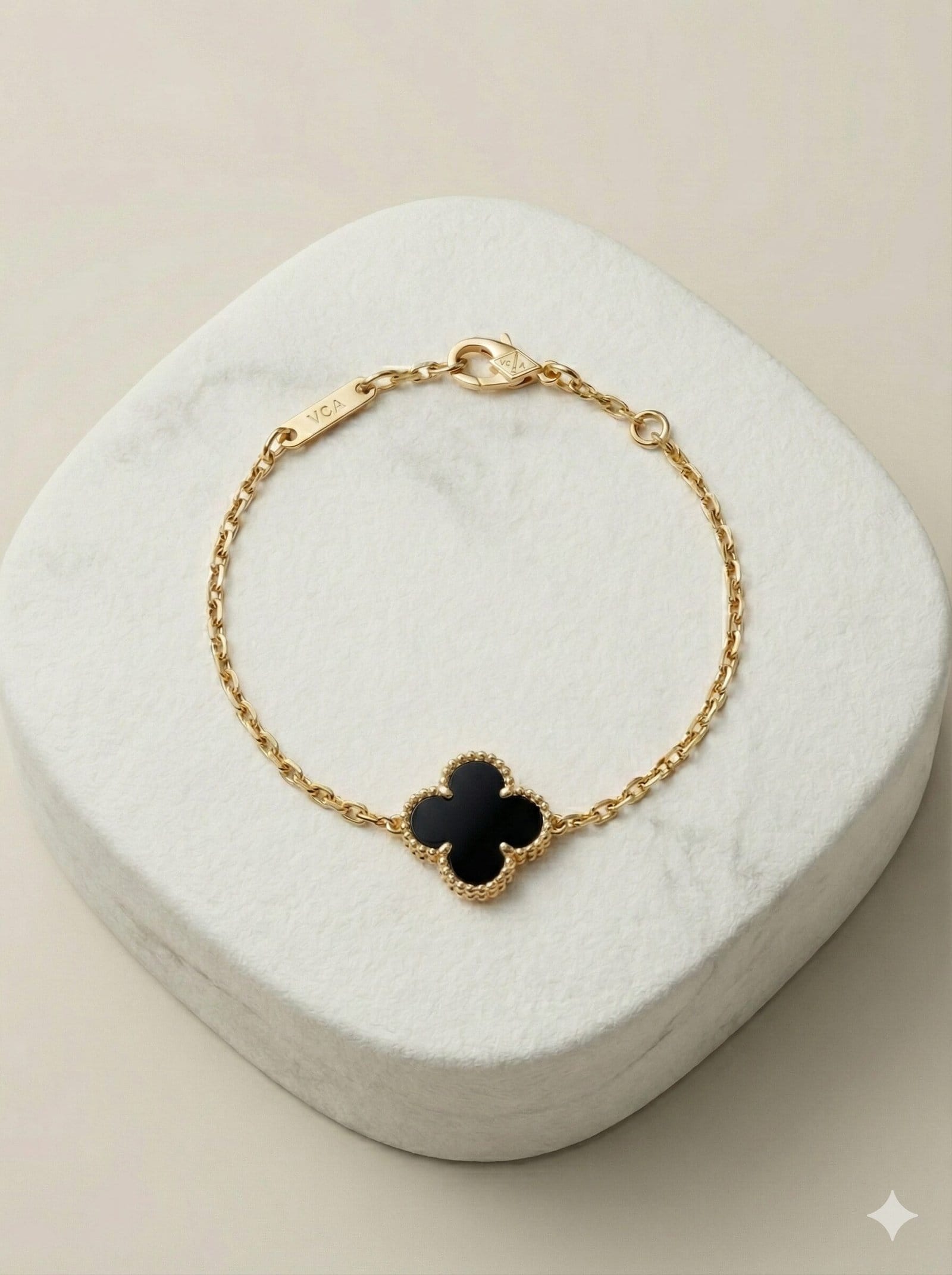 Gold-Tone Chain Bracelet with Single Black Quatrefoil Motif
