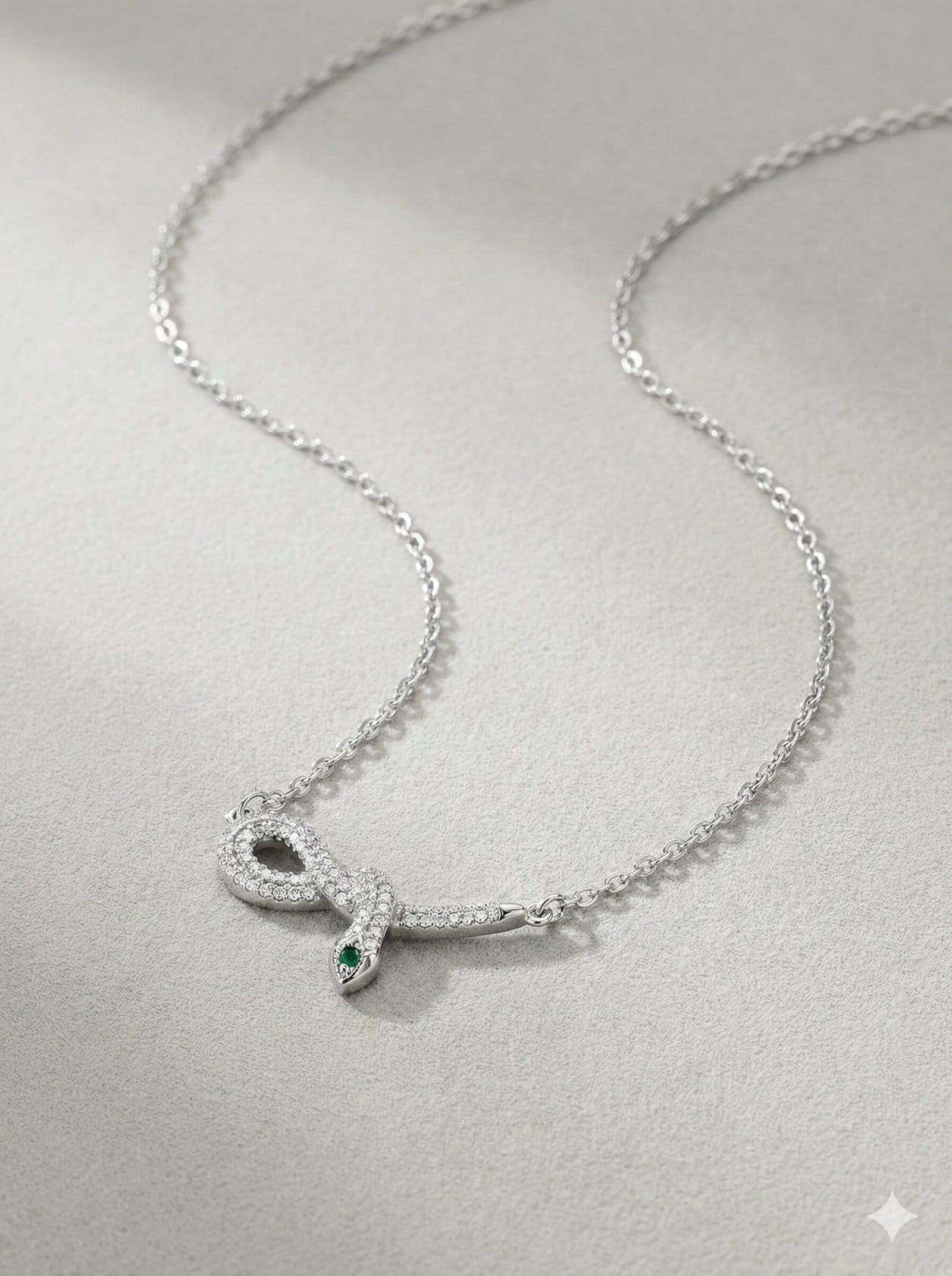 Silver-Tone Coiled Snake Pendant Necklace with Clear Pavé Stones and Green Accents