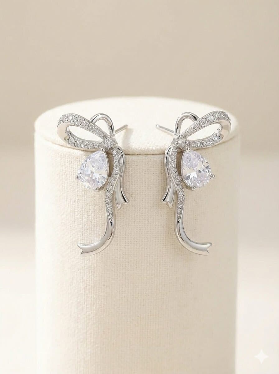 Silver-Toned Pave Ribbon Bow Stud Earrings with Pear-Cut Stone Accent — image 2